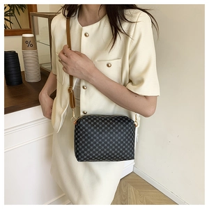 Chic retro shoulder bag with grey geometric patterns and adjustable brown leather strap