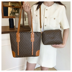 Detail of vintage geometric print tote and matching pouch set in a warm cafe setting
