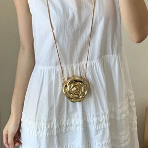 Elegant gold rose flower evening bag with metallic finish and delicate snake chain strap