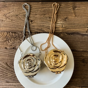 Metallic flower evening handbag with chain strap in gold and silver finish