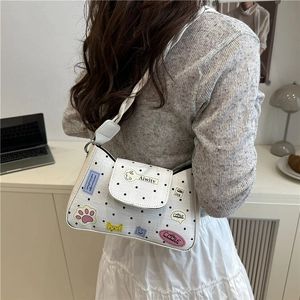 White polka dot shoulder bag with cute cartoon patches and woven leather strap handle