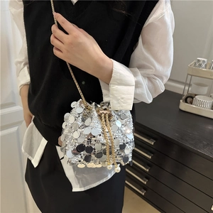 Silver sequin bucket bag with gold chain strap and pearl drawstring for parties