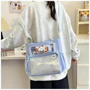Detail of lavender ita bag featuring double transparent windows and adjustable strap