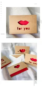 Detailed view of laser-cut heart and arrow designs on kraft paper greeting cards