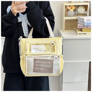 Detail view of light yellow tote with transparent PVC pockets and side drawstring storage