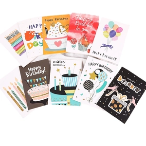 Set of 9 colorful birthday cards with balloons and cakes on light textured fabric