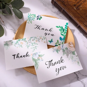 Floral watercolor thank you cards set with gold foil lettering and matching envelopes