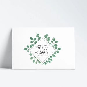 Detail of greeting card featuring green watercolor leaves and Best wishes text with envelope