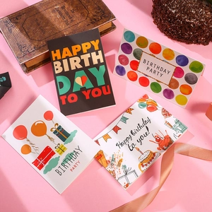 Set of 4 colorful Happy Birthday greeting cards with envelopes on a festive background