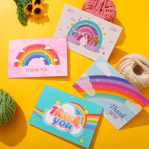 Set of four colorful thank you cards with rainbow and star designs on yellow background