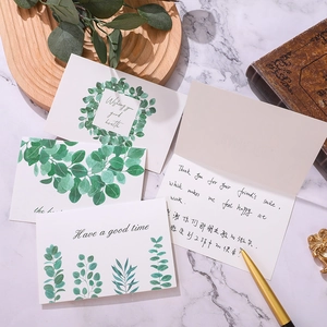 Eucalyptus botanical greeting cards set with envelopes and gold pen on marble desk