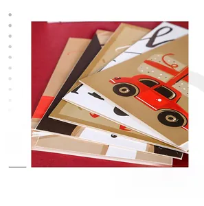 Close-up of assorted foldable Christmas cards featuring festive holiday illustrations