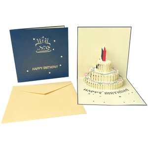 Detail of 3D pop-up birthday cake card with gold foil cover and cream envelope