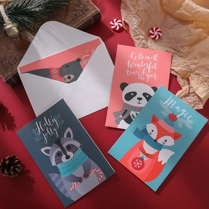 Set of four creative Christmas cards featuring animal themes on festive red background