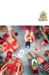 Close-up of festive Christmas gift tags with Santa and tree designs on blue wood