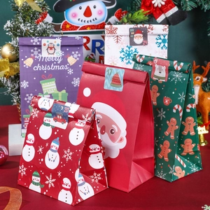Set of 24 Christmas kraft paper advent calendar gift bags with festive numbered stickers
