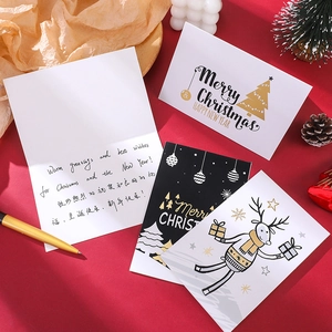 Detail of creative Christmas card set with gold stamping and interior holiday greetings
