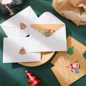 Christmas kraft greeting card set with white envelopes and festive holiday ornaments
