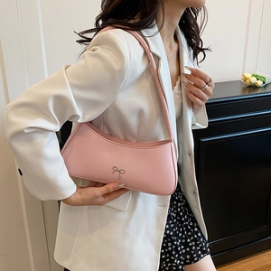 Minimalist light pink hobo shoulder bag with metal bow detail for women chic fashion