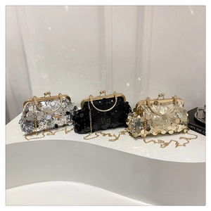 Detailed view of sequin evening clutch bags in silver, gold, and black with metal handles
