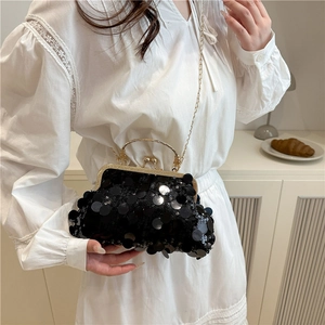 Elegant black sequin clutch with gold chain strap and metal handle for women