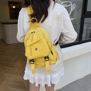 Large yellow nylon backpack for commuting and travel with double zippers and fashion logo