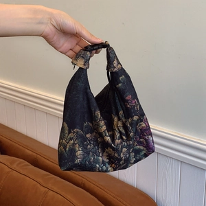 Vintage floral printed Xiangyun Silk handbag with a unique buckle and knotted handle