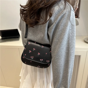 Chic black crossbody bag with red cherry graffiti pattern for 2025 summer casual wear