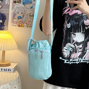 Minimalist light blue drawstring crossbody bag for women with front zipper pocket