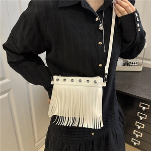 White bohemian leather tote bag with fringe tassels and metallic stud details
