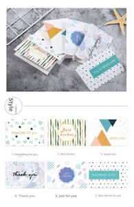 Detailed view of six mini greeting card designs with gold foil best wishes lettering