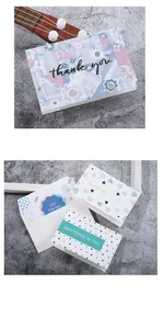 Close-up of artistic greeting cards with minimalist floral and geometric patterns