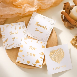 Set of 4 elegant square greeting cards with gold foil designs on white premium cardstock