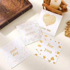 Set of four elegant white greeting cards with gold foil stamps for various occasions
