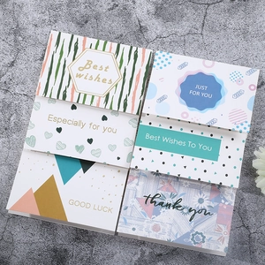 Detail view of 6 minimalist watercolor greeting cards with gold stamping and white envelopes
