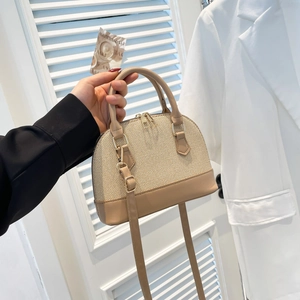 Fashionable beige woven shell handbag with leather trim and shoulder strap for women