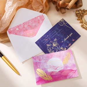 Elegant gold foil thank you cards set with floral patterns and matching envelopes