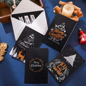 Christmas greeting card set with gold foil reindeer and tree designs on black cardstock