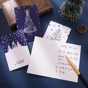 Retro Christmas cards set with artistic hand-drawn trees, envelopes and fountain pen