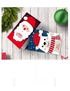 Detail of Christmas cards featuring Santa and polar bear on festive wooden background