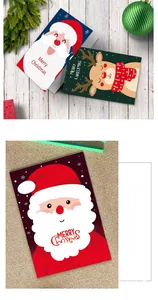 Close-up of a Christmas card set with Santa Claus and reindeer on a rustic background