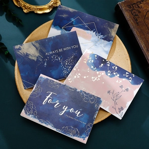 Artistic gold-stamped birthday greeting cards with floral watercolor design and envelopes