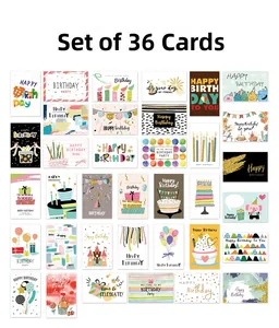 Flat lay of 36 colorful birthday cards with festive illustrations and gold foil lettering