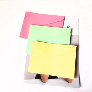 Three-color pastel stationery envelopes set in pink, green, and yellow for invitations