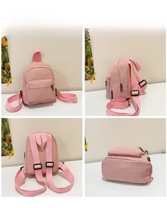 Multi-angle view of a pink mini nylon backpack featuring main and front zip pockets