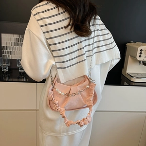 Pink pleated cloud bag for women featuring a metal chain strap with pearls and clovers