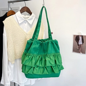 Green pleated canvas tote bag with large ruffles and drawstring closure for women