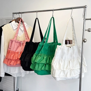 Women's pleated canvas tote bags in four colors with tiered ruffles and drawstring closure