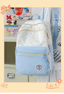 Close-up of star-patterned campus backpack with multi-pocket design and cat paw detail