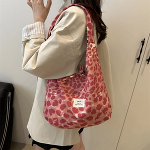 Pink leopard print canvas tote bag with bow detail and large capacity shoulder straps